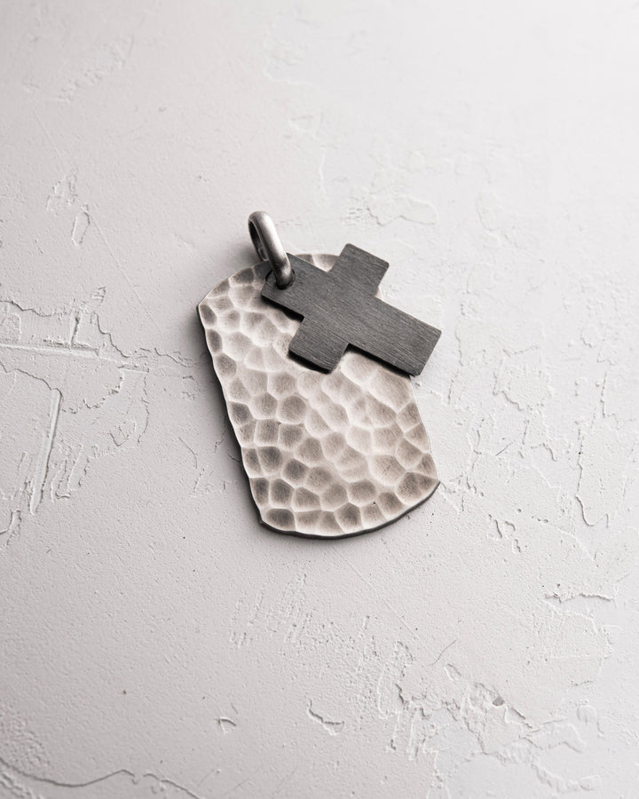 Silver structured cross dog tag with a STRUGGLE