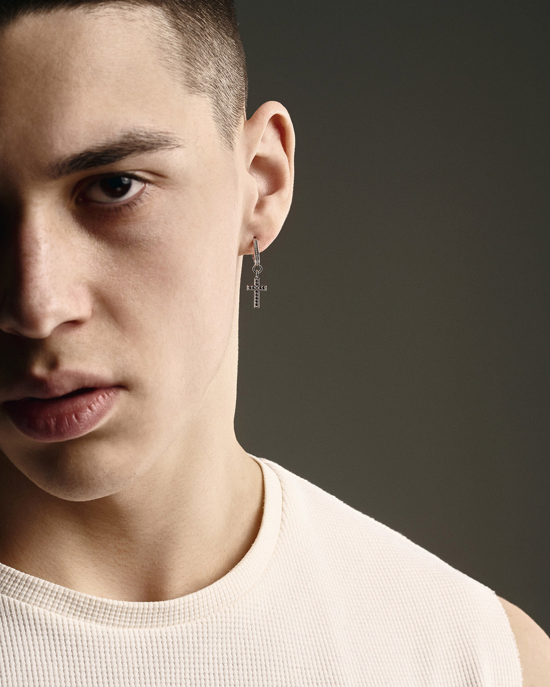 14k white gold single earring CROSS. BLACK STONES