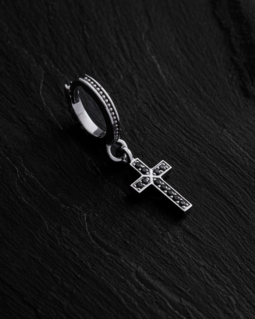 14k white gold single earring CROSS. BLACK STONES