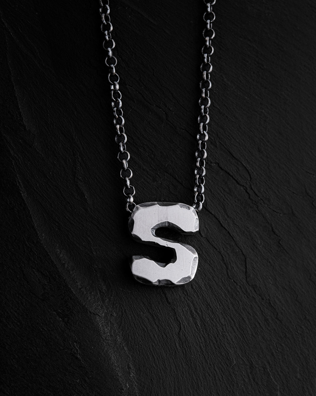 Letter S pendant on a chain