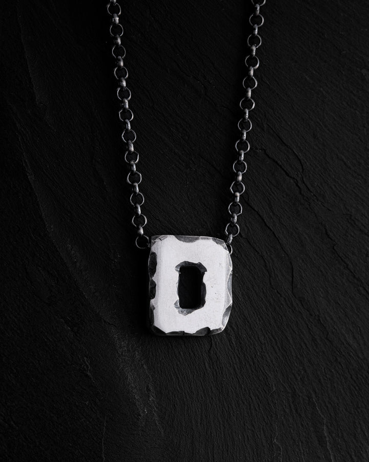 Letter D pendant on a chain