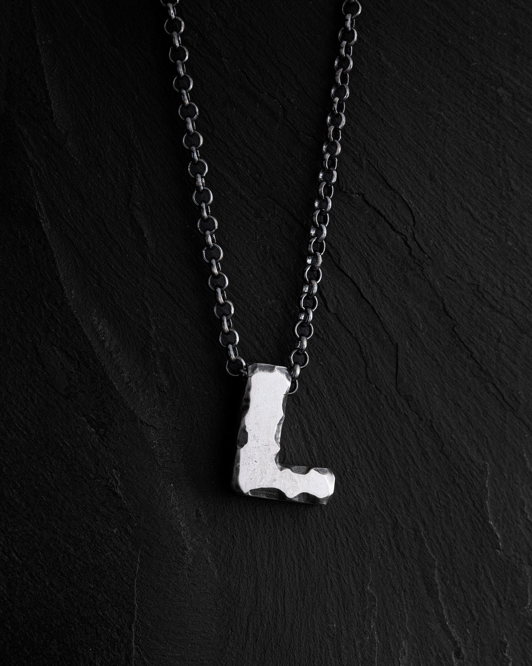 Letter L pendant on a chain