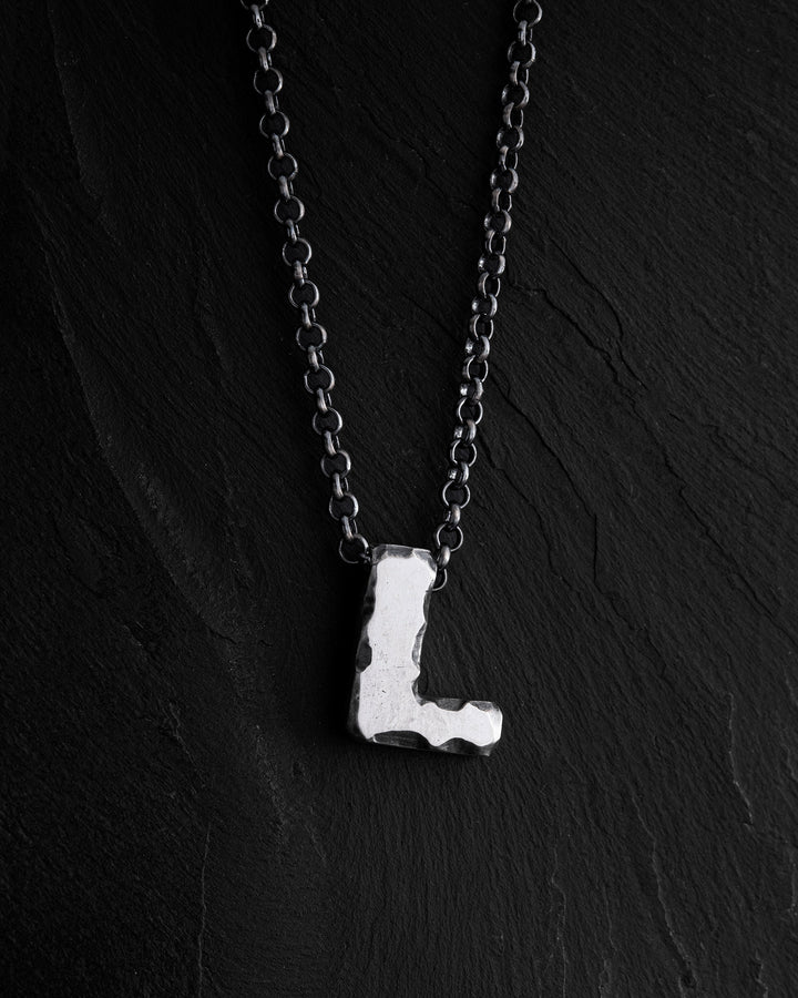 Letter L pendant on a chain