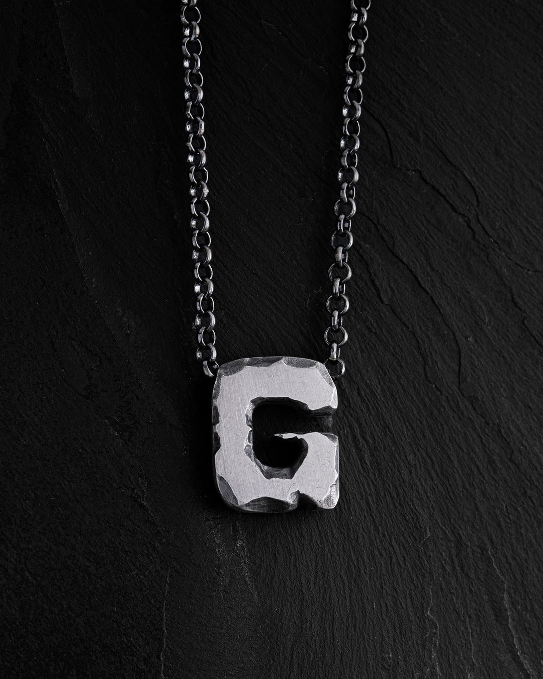 Letter G pendant on a chain