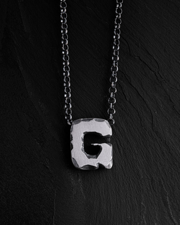Letter G pendant on a chain