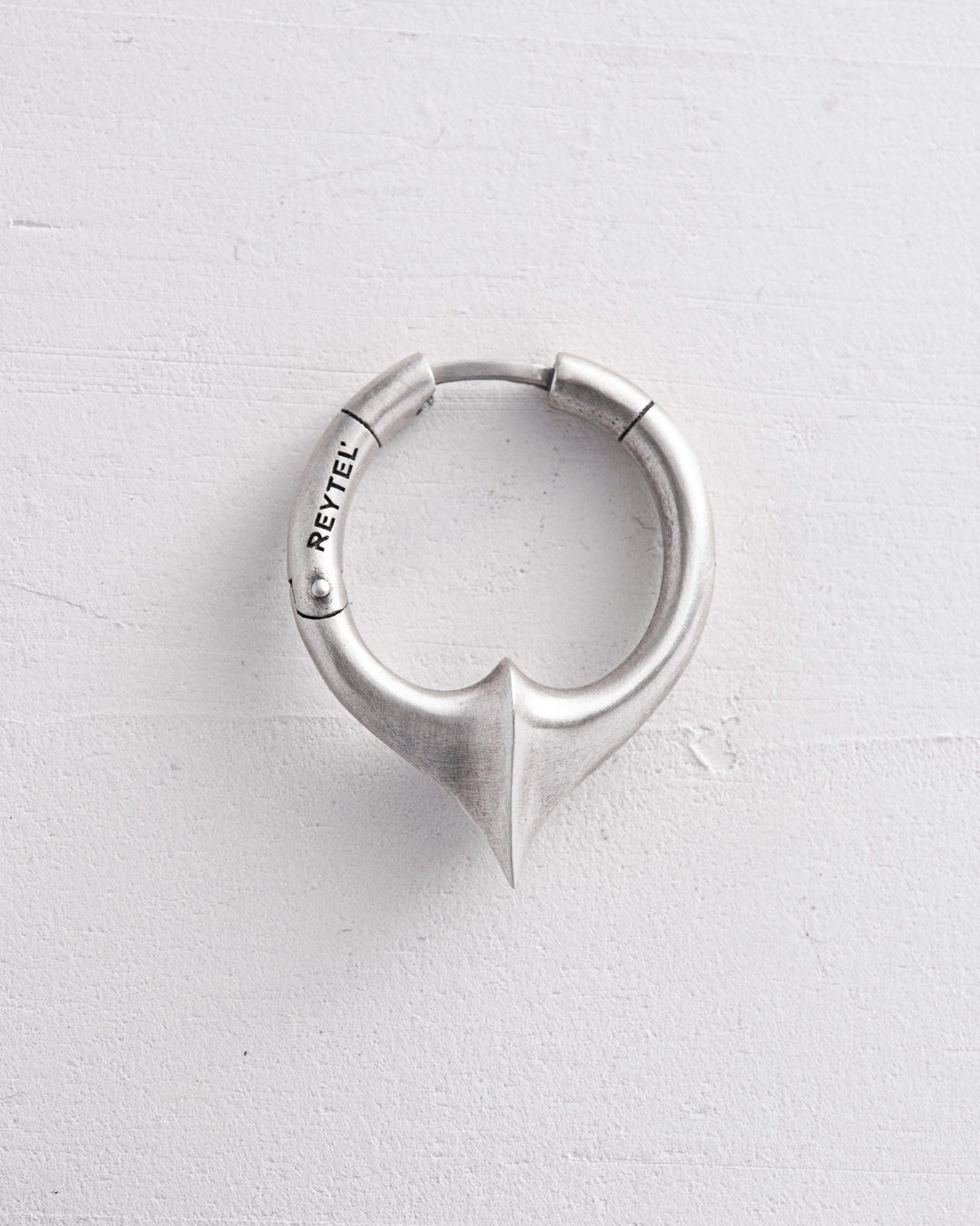 Silver single earring REBELLION