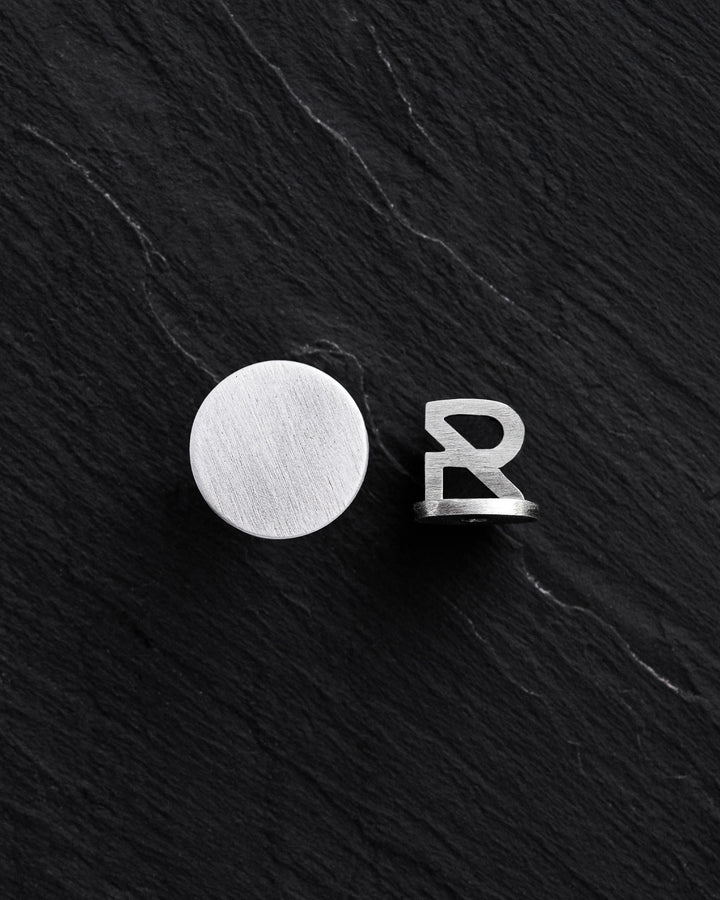 Silver single earring PUNKT
