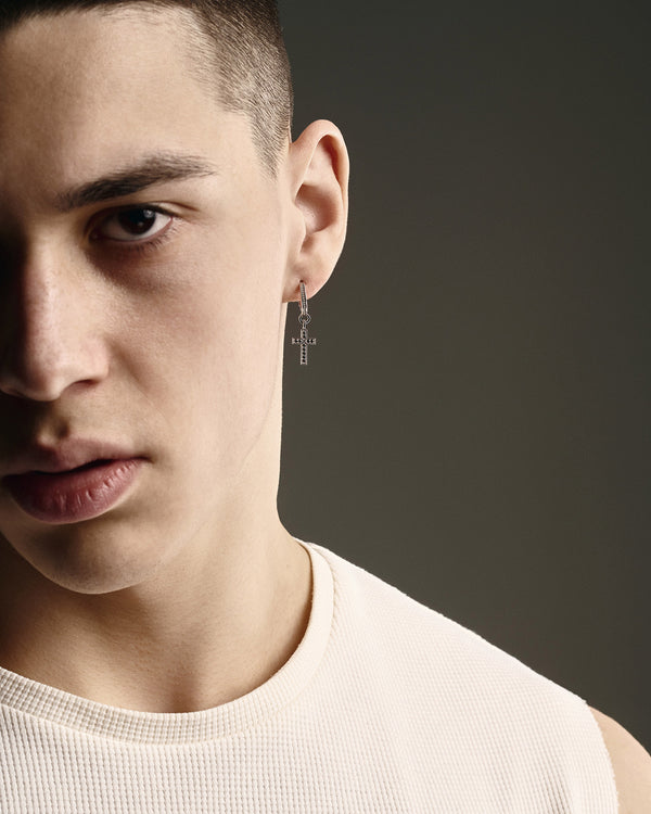 14k white gold single earring CROSS. BLACK STONES