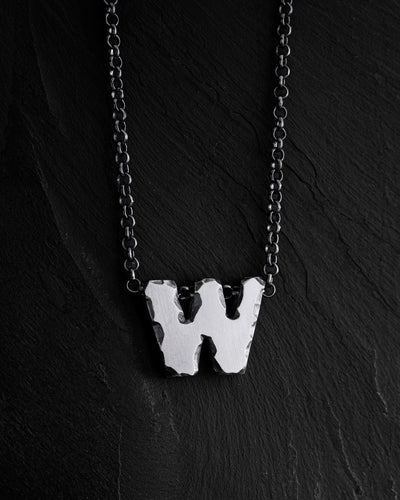 Letter W pendant on a chain