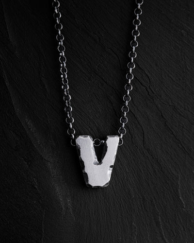 Letter V pendant on a chain