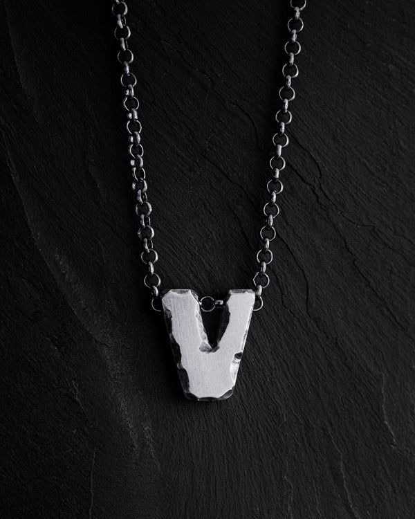 Letter V pendant on a chain