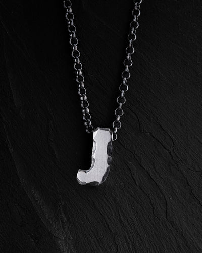 Letter J pendant on a chain