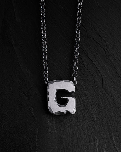Letter G pendant on a chain