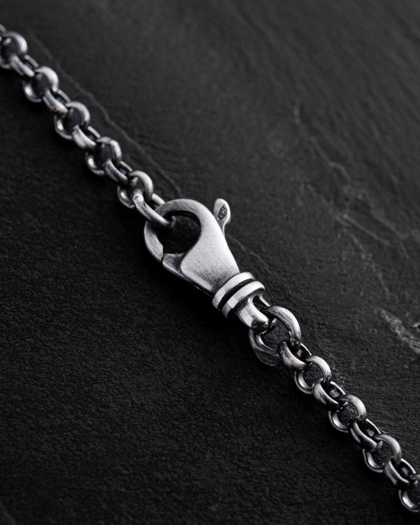 Letter J pendant on a chain