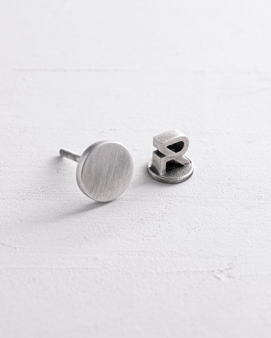 Silver single earring PUNKT