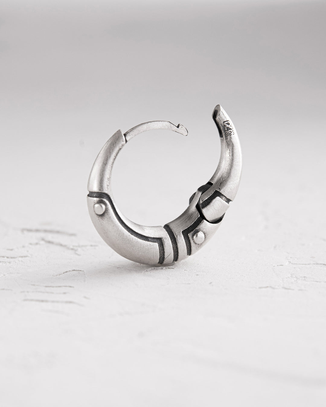 Silver monoearring AXE